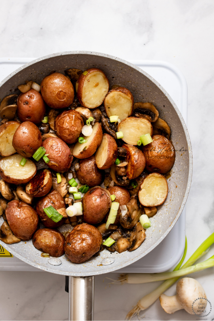 Cajun Spiced Mushrooms And Potatoes In A Pan. 
